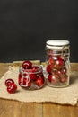 Delicious ripe cherries inside glass jars Royalty Free Stock Photo