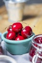 Delicious ripe cherries inside a small blue porcelain bowl Royalty Free Stock Photo