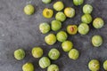 Delicious ripe green plums Greengages Black concrete background