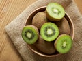 Delicious ripe kiwi fruits in a wooden bowl Royalty Free Stock Photo