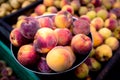 Delicious ripe peaches for sale at an urban street market