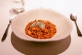 Delicious risotto with sea urchin caviar, shrimp and raw squid tartare Selective focus