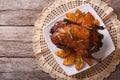 Delicious Roast duck with oranges on a plate. Horizontal top vie