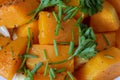 Delicious roasted butternut squash and herbs, close-up