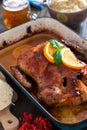 Delicious roasted duck with oranges in a pan, rustic style Royalty Free Stock Photo