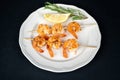 Delicious roasted shrimps on skewers