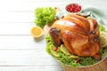 Delicious roasted turkey for traditional festive dinner on wooden table