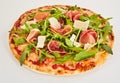 Delicious rocket and prosciutto Italian pizza