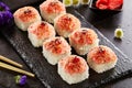 Delicious roll with masago caviar cap close up