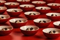 Delicious Rows of Dumplings and Bowls of Soy Sauce on Red Background AI Generated Royalty Free Stock Photo