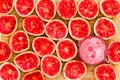 Delicious ruby red grapefruit halves by glass Royalty Free Stock Photo