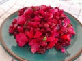 Delicious Russian red vegetable salad with beetroot, vinaigrette on blue ceramic plate