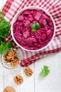 Delicious salad with boiled beets, herring, nuts, onions Royalty Free Stock Photo