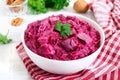 Delicious salad with boiled beets, herring, nuts, onions Royalty Free Stock Photo