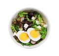 Delicious salad with boiled egg, feta cheese and vegetables in bowl isolated on white, top view Royalty Free Stock Photo