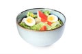 Delicious salad with crab sticks and eggs in ceramic bowl on white background Royalty Free Stock Photo