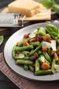 Delicious salad with green beans, mushrooms and cheese on wooden table, closeup Royalty Free Stock Photo