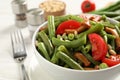 Delicious salad with green beans, mushrooms, pine nuts and tomatoes on white table, closeup Royalty Free Stock Photo