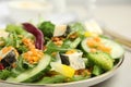 Delicious salad with lentils, vegetables and cheese on light grey table, closeup