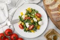 Delicious salad with pesto sauce, ingredients and fork on white marble table, flat lay Royalty Free Stock Photo