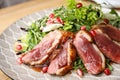 Delicious salad with roasted duck breast on plate, closeup Royalty Free Stock Photo