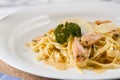 Delicious salmon pasta dish, tagliatelle noodles with Parmesan and parsley Royalty Free Stock Photo