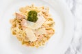 Delicious salmon pasta dish, tagliatelle noodles with Parmesan and parsley Royalty Free Stock Photo