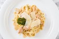 Delicious salmon pasta dish, tagliatelle noodles with Parmesan and parsley Royalty Free Stock Photo