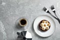 Delicious salted caramel chocolate tart with meringue and coffee on light grey marble table, flat lay Royalty Free Stock Photo
