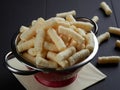 Delicious salty corn puffs snack, also known in Romanian as pufuleti Royalty Free Stock Photo