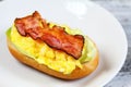 Delicious sandwich with bacon, scrambled egg and lettuce Royalty Free Stock Photo