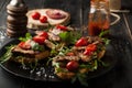 Delicious sandwich with meat with arugula and tomatoes Royalty Free Stock Photo