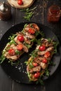 Delicious sandwich with meat with arugula and tomatoes Royalty Free Stock Photo