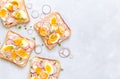 Delicious sandwiches with soft cream cheese, radishes, eggs and onions Royalty Free Stock Photo