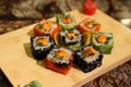 Delicious sauced Saka na maki sushi rolls Royalty Free Stock Photo