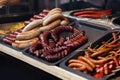 Delicious sausages bbq at market fest, grilling on open grill, o Royalty Free Stock Photo