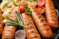 Delicious sausages with on grill pan, closeup. Barbecue food