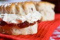 A delicious scone with clotted cream and jam Royalty Free Stock Photo