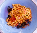 Delicious seafood big spaghetti with fresh tomato. Traditional Italian food Royalty Free Stock Photo