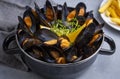 Delicious seafood mussels with parsley sauce and lemon. Delicious steamed mussels