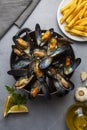 Delicious seafood mussels with parsley sauce and lemon. Delicious steamed mussels