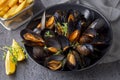 Delicious seafood mussels with parsley sauce and lemon. Delicious steamed mussels