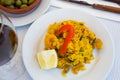 Delicious seafood paella - traditional Valencian rice dish with shrimps, calamari and shellfish