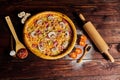 Delicious seafood shrimps and mussels pizza on a black wooden table. Italian food. Top view Royalty Free Stock Photo