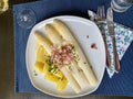 Delicious seasonal white asparagus with creamy mayonnaise, boiled potatoes and sliced ham Royalty Free Stock Photo