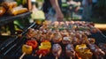 Delicious shashlik skewers with meat and vegetables on a charcoal grill outdoors