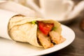 Delicious shawarma rolled sandwich with meat and vegetables Royalty Free Stock Photo