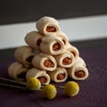 Delicious shortbread rolls with jam filling. Baking pyramid. Sweet pastries, dessert food concept. Square format or 1x1