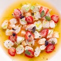 Delicious shrimp ceviche with strawberries, spices and lemon