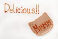 Delicious sign with ketchup and mmmm on the bread with pate Royalty Free Stock Photo